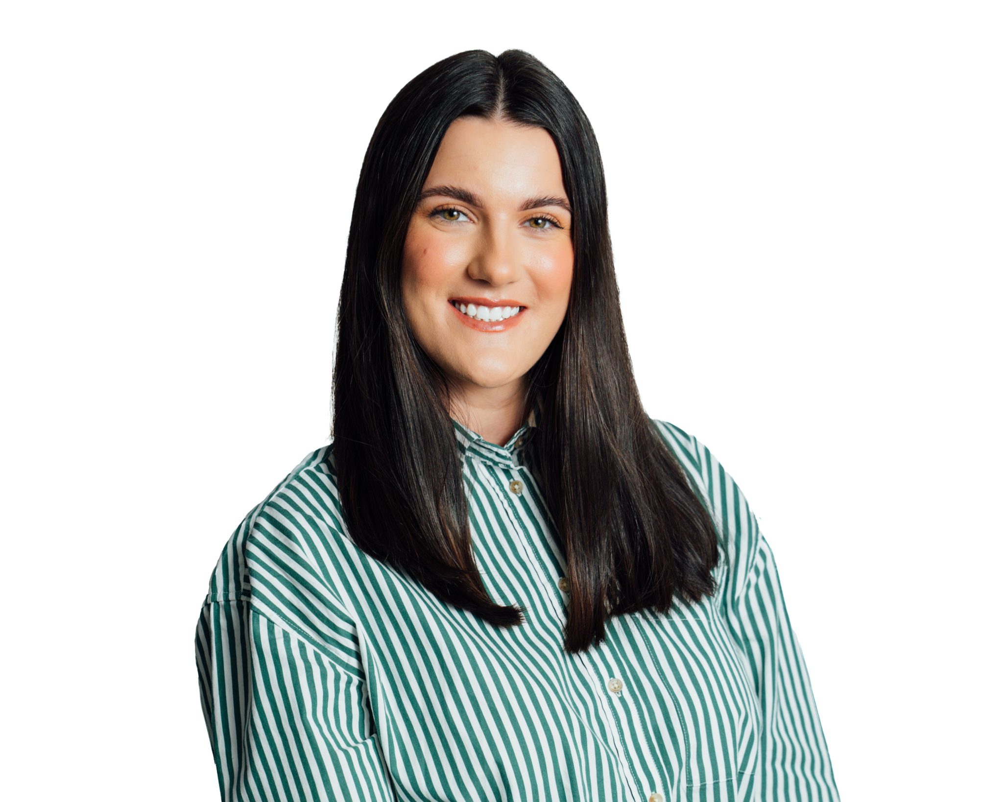 An image of Alix Baird smiling at he camera with a green shirt.